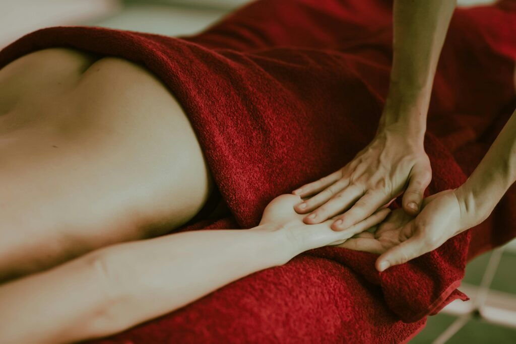 Experience relaxation with this close-up of a massage therapy session, highlighting hands on skin.