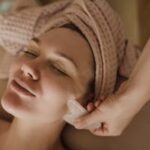 A serene facial massage session using a gua sha tool for skin rejuvenation and relaxation.